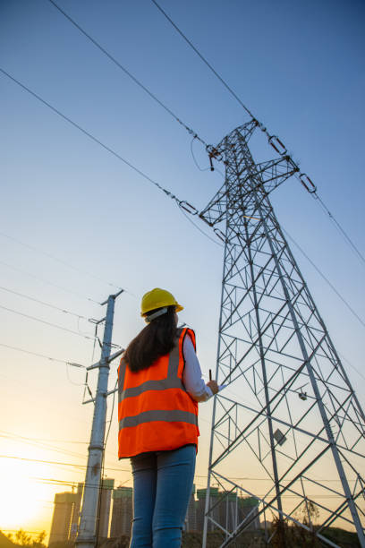 female engineer working at a electrical pylons translation